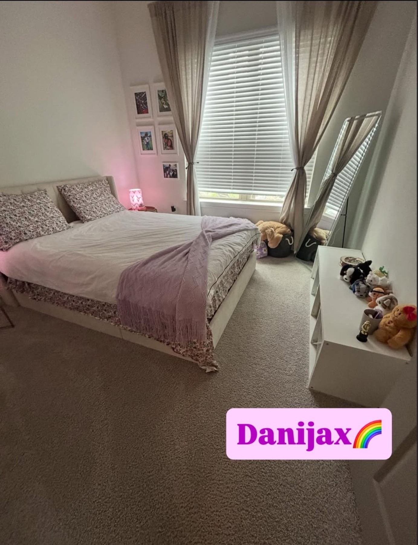 Freshly tidied bedroom with a made bed, smoothed throw blanket and clear carpeted floor
